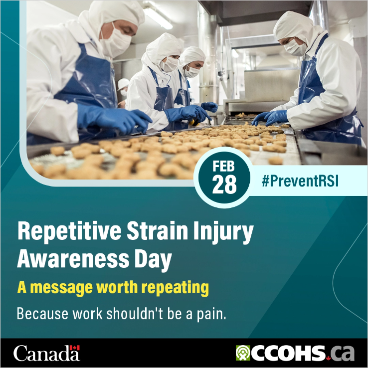 Workers in protective clothing examining food along an assembly line.